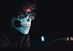 hacker wearing skeleton face mask