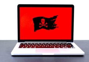 ransomware - pirate flag on laptop screen