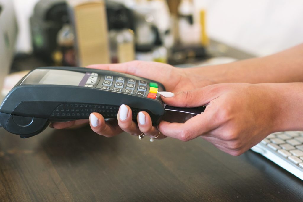person making payment with a chip card