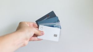 hand holding credit and debit cards