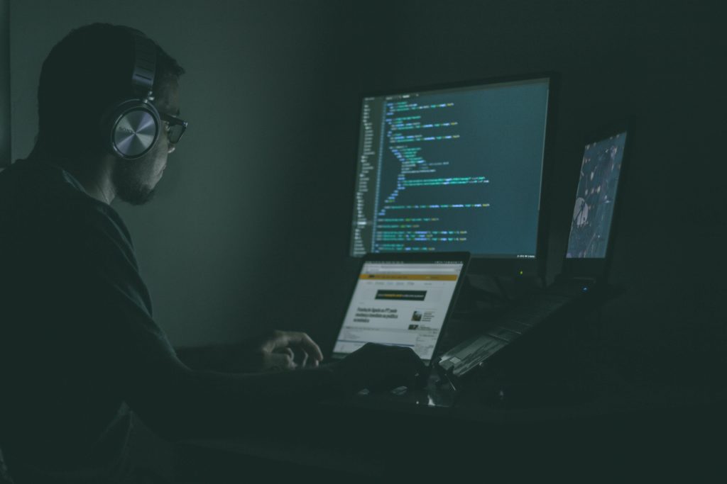 hacker coding on computer