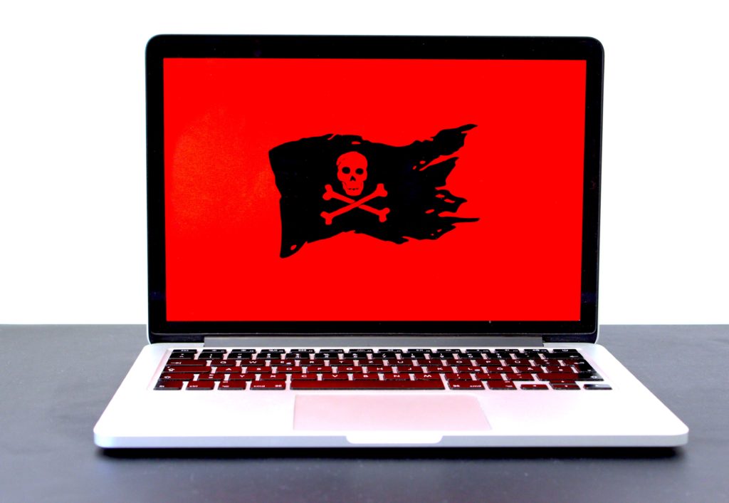 ransomware - pirate flag on laptop screen